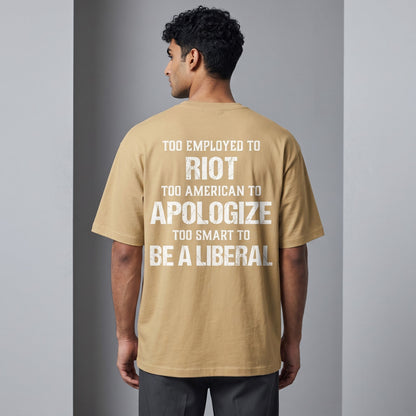  tan oversized t-shirt with white distressed text print on the back, worn by a man from behind.
