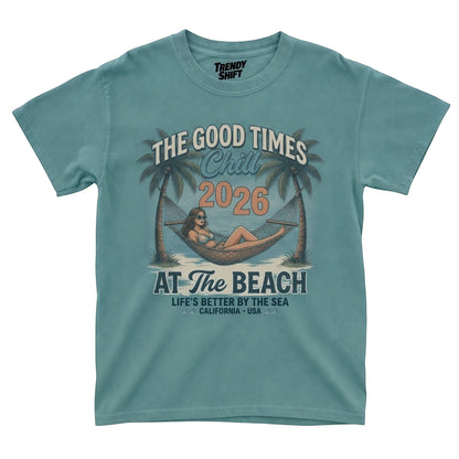 retro teal graphic t-shirt featuring a woman in a hammock between palm trees and beach text.